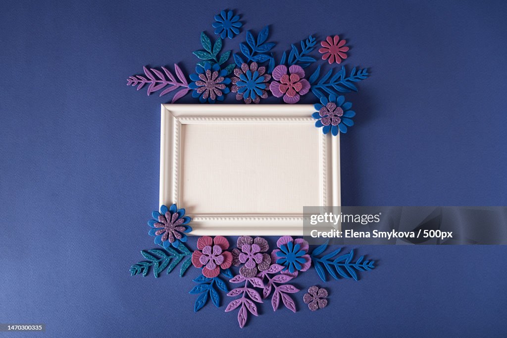 White horizontal frame with handmade flowers on a purple background Cut from paper Place your text,Moscow,Russia
