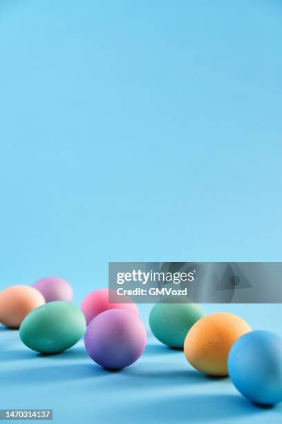 easter decoration with easter eggs on vibrant background - easter background stock pictures, royalty-free photos & images