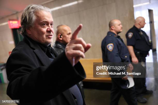 Steve Bannon, former advisor to President Donald Trump, points as he speaks after leaving a court appearance at NYS Supreme Court on February 28,...