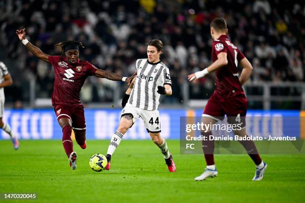 Nicolo Fagioli of Juventus is challenged by Yann Karamoh of Torino FC during the Serie A match between Juventus and Torino FC at Allianz Stadium on...