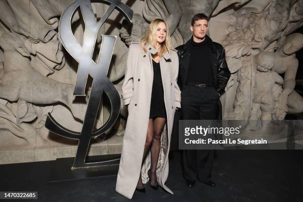 Virginie Efira and Niels Schneider attend the Saint Laurent Womenswear Fall Winter 2023-2024 show as part of Paris Fashion Week on February 28, 2023...