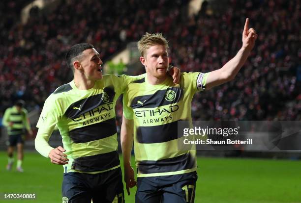 Kevin De Bruyne of Manchester City celebrates after scoring the team's third goal with teammate Phil Foden during the Emirates FA Cup Fifth Round...