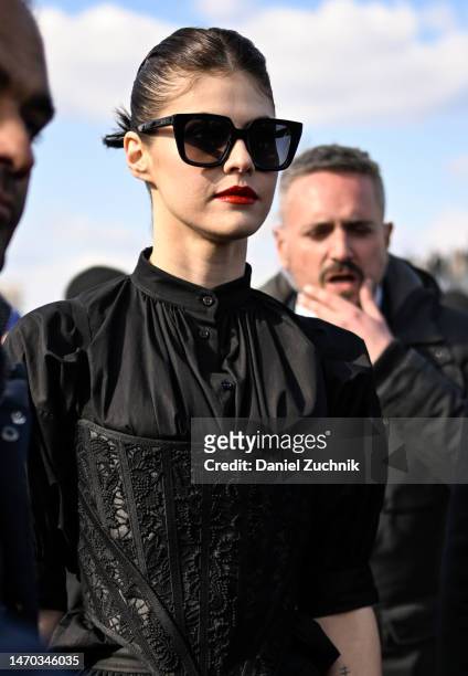 Alexandra Daddario is seen wearing a Dior outfit and Dior sunglasses outside the Dior show during Paris Fashion Week F/W 2023 on February 28, 2023 in...