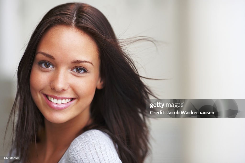 Close-up of a young woman smiling