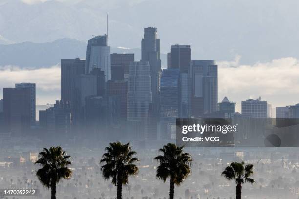 Clouds hover in the background of downtown Los Angeles skyline on February 28, 2023 in Los Angeles, CA.