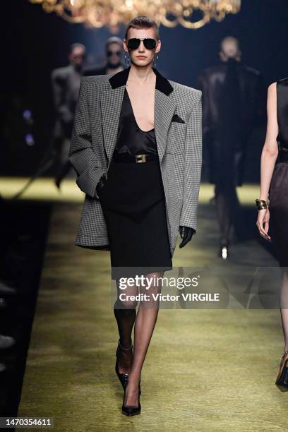 Model walks the runway during the Saint Laurent Ready to Wear Fall/Winter 2023-2024 fashion show as part of the Paris Fashion Week on February 28,...