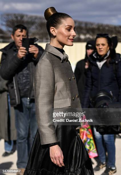 Olivia Palermo is seen wearing a Dior jacket, black Dior skirt and black floral Dior bag outside the Dior show during Paris Fashion Week F/W 2023 on...