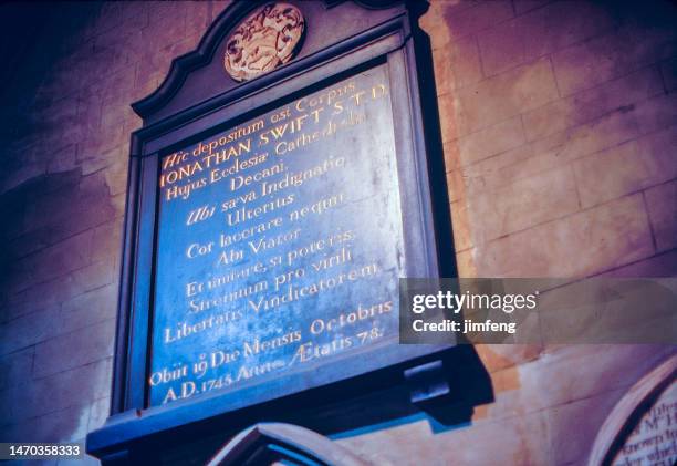 1980s old positive film scanned, latin inscription concerning jonathan swift in st patrick's cathedral, dublin, ireland - st patrick's day dublin stock pictures, royalty-free photos & images