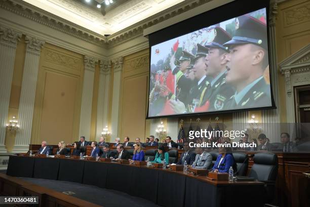 Video on the Chinese Communist Party is played during a hearing of the House Select Committee on Strategic Competition between the United States and...