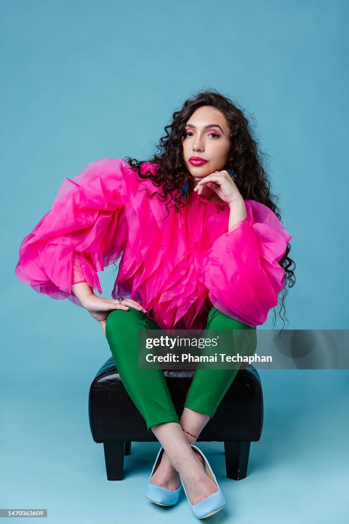 Beautiful woman sitting on a stool