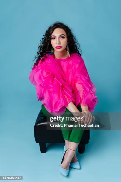 beautiful woman sitting on a stool - pink lipstick stock pictures, royalty-free photos & images