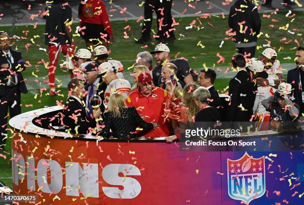 Head coach Andy Reid and quarter back Patrick Mahomes of the Kansas City Chiefs stands on the podium with owner Clark Hunt celebrating with the...