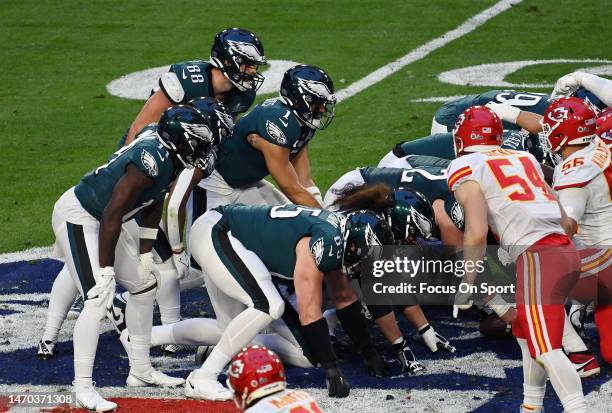 Jalen Hurts of the Philadelphia Eagles lines up under center to take the snap against the Kansas City Chiefs during the first half in Super Bowl LVII...