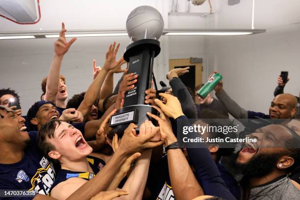 The Marquette Golden Eagles celebrate winning the Big East regular season championship after a win over the Butler Bulldogs at Hinkle Fieldhouse on...