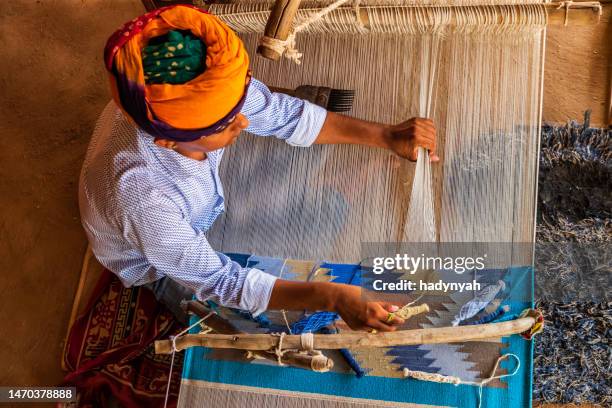indian man weaving textiles (durry) in rajasthan - loom stock pictures, royalty-free photos & images