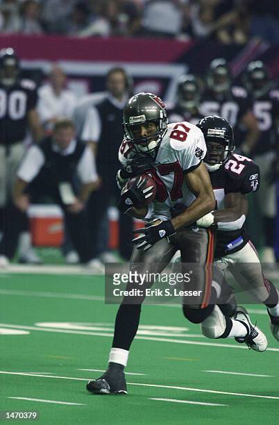 Tampa Bay Buccaneers receiver Keenan McCardell drags Atlanta Falcons cornerback Fred Weary during a reception in the second half on October 6 at the...