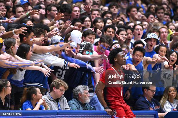 The Cameron Crazies taunt Jarkel Joiner of the North Carolina State Wolfpack as he waits to inbound the ball against the Duke Blue Devils during the...