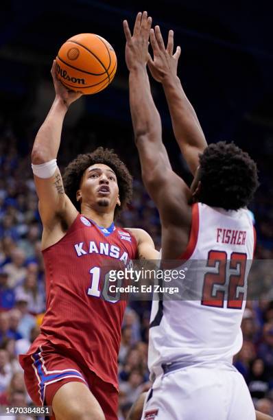Jalen Wilson of the Kansas Jayhawks shoots over Elijah Fisher of the Texas Tech Red Raiders in the first half at Allen Fieldhouse on February 28,...