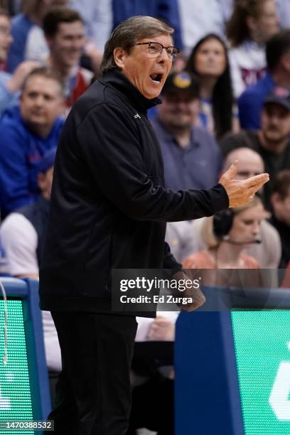 Head coach Mark Adams of the Texas Tech Red Raiders directs his team against the Kansas Jayhawks in the first half at Allen Fieldhouse on February...