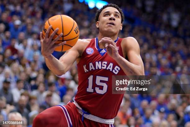 Kevin McCullar Jr. #15 of the Kansas Jayhawks lays the ball up against the Texas Tech Red Raiders in the first half at Allen Fieldhouse on February...