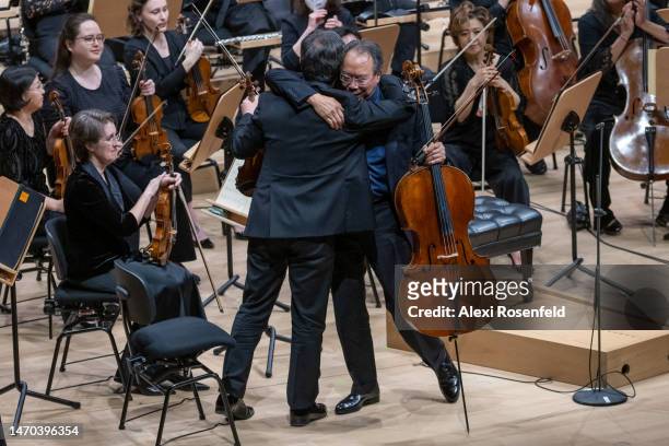 Yo-Yo Ma hugs the New York Philharmonic concertmaster Frank Huang at David Geffen Hall on February 28, 2023 in New York City. Yo-Yo Ma performed in a...