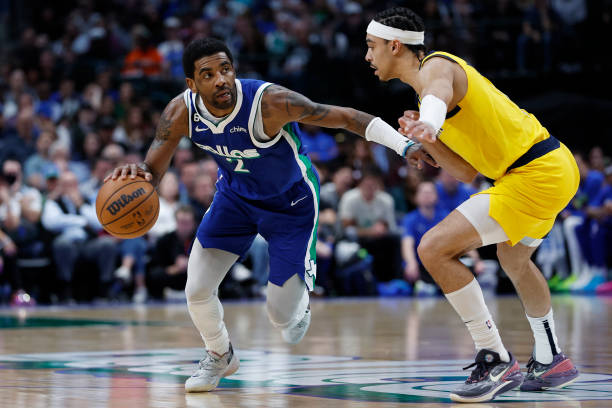 Kyrie Irving of the Dallas Mavericks dribbles to the basket against Andrew Nembhard of the Indiana Pacers in the second half at American Airlines...