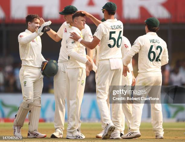 Matthew Kuhnemann of Australia celebrates taking the wicket of Rohit Sharma of India during day one of the Third Test match in the series between...