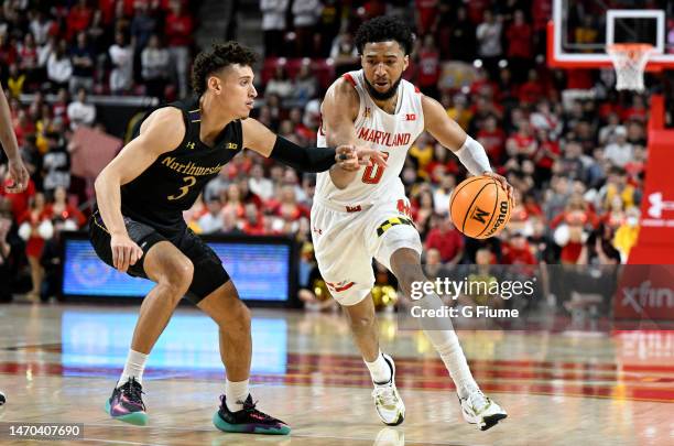 Don Carey of the Maryland Terrapins handles the ball against Ty Berry of the Northwestern Wildcats at Xfinity Center on February 26, 2023 in College...