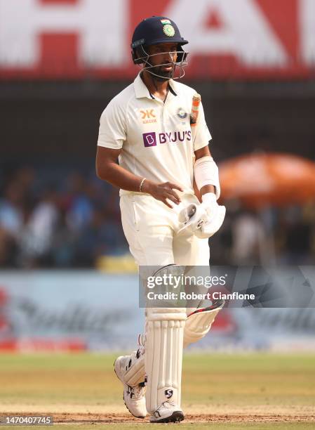 Cheteshwar Pujara of India walks off after he was dismissed by Nathan Lyon of Australia during day one of the Third Test match in the series between...