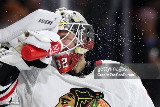 Alex Stalock of the Chicago Blackhawks during a timeout in the second period at Mullett Arena on February 28, 2023 in Tempe, Arizona.