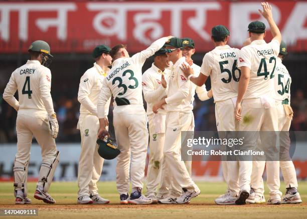 Matthew Kuhnemann of Australia celebrates taking a catch to dismiss Ravindra Jadeja of India during day one of the Third Test match in the series...