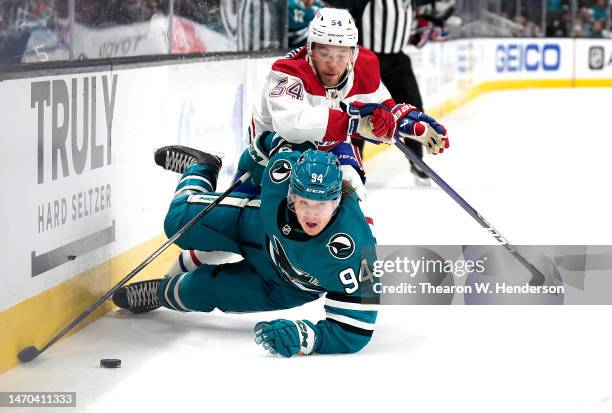 Jordan Harris of the Montreal Canadiens collides with Alexander Barabanov of the San Jose Sharks knocking Barabanov to the ice during the second...