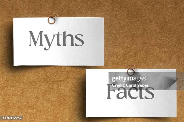 sticky notes showing myths and facts message - sander ストックフォトと画像