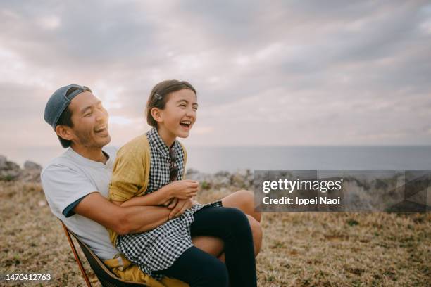 father and young daugter having fun by sea - portrait of a camper stock pictures, royalty-free photos & images