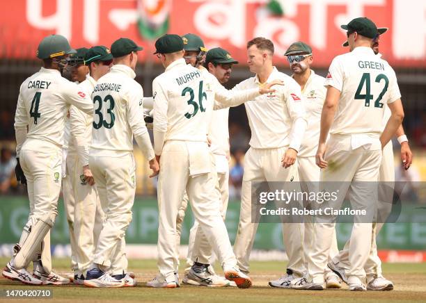 Matthew Kuhnemann of Australia celebrates taking the wicket of Ravichandran Ashwin of India during day one of the Third Test match in the series...