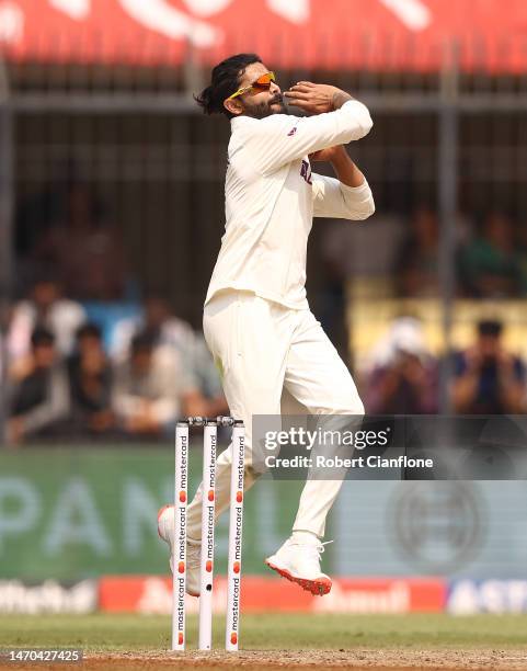 Ravindra Jadeja of India bowls during day one of the Third Test match in the series between India and Australia at Holkare Cricket Stadium on March...