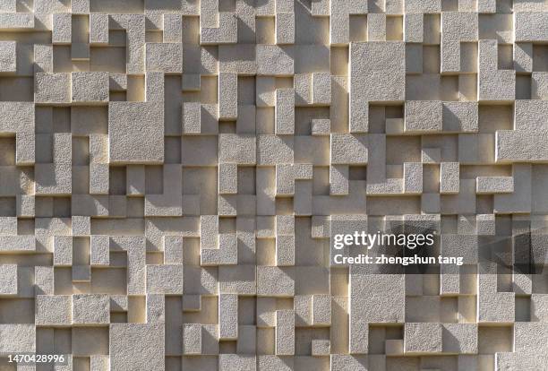 a stone cubes wall - samenhang stockfoto's en -beelden