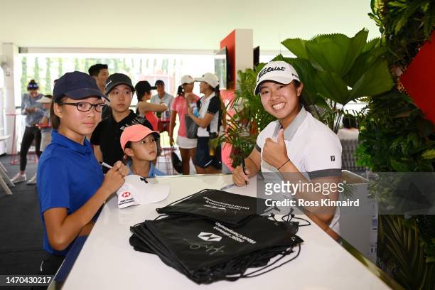 Amanda Tan of Singapore poses for a photo as she signs autographs after a HSBC Sport junior clinic prior to the HSBC Women's World Championship at...