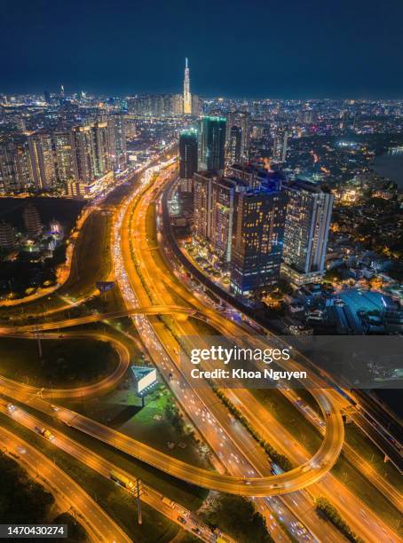 top view aerial of ha noi highway and cat lai crossroads, ho chi minh city with development buildings, transportation, infrastructure, vietnam. - modern vietnam stock pictures, royalty-free photos & images