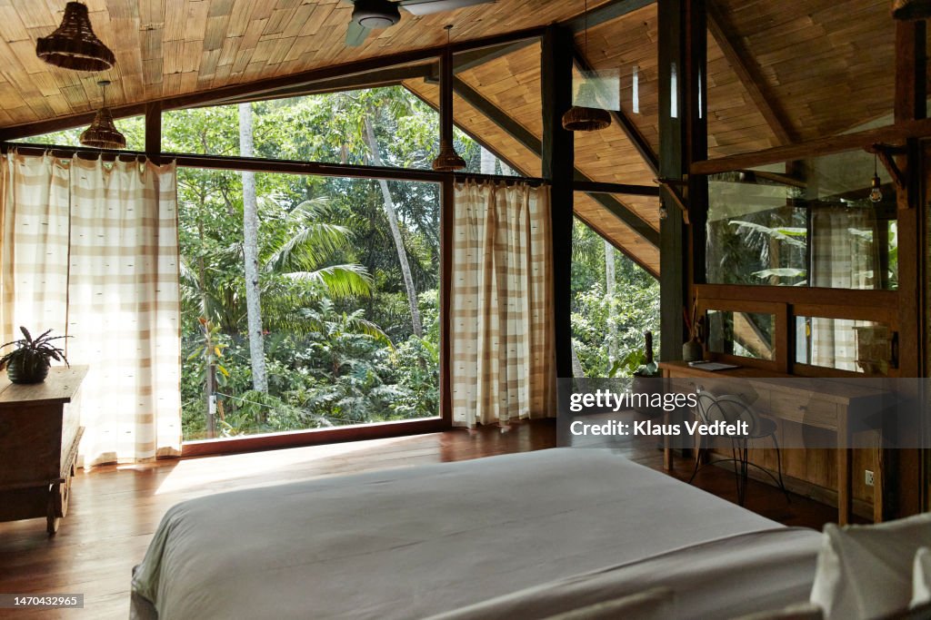Elegant bedroom with furniture at resort villa