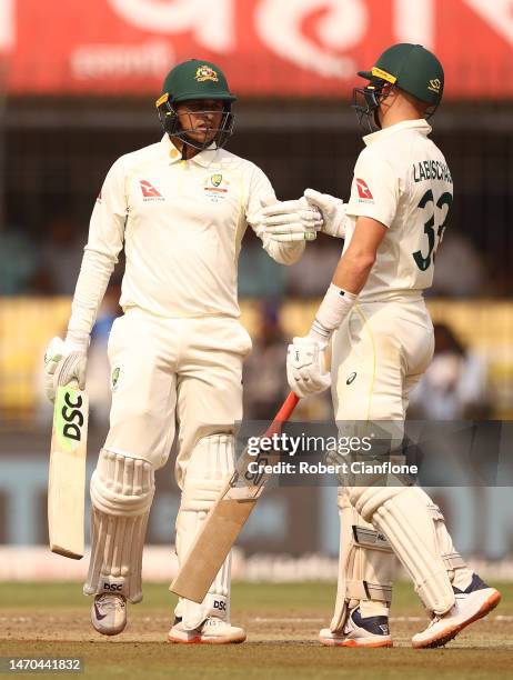 Usman Khawaja of Australia celebrates with Marnus Labuschagne after scoring his half century during day one of the Third Test match in the series...