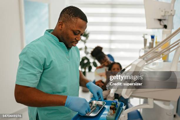 lets help little guy - dental hygienist stock pictures, royalty-free photos & images