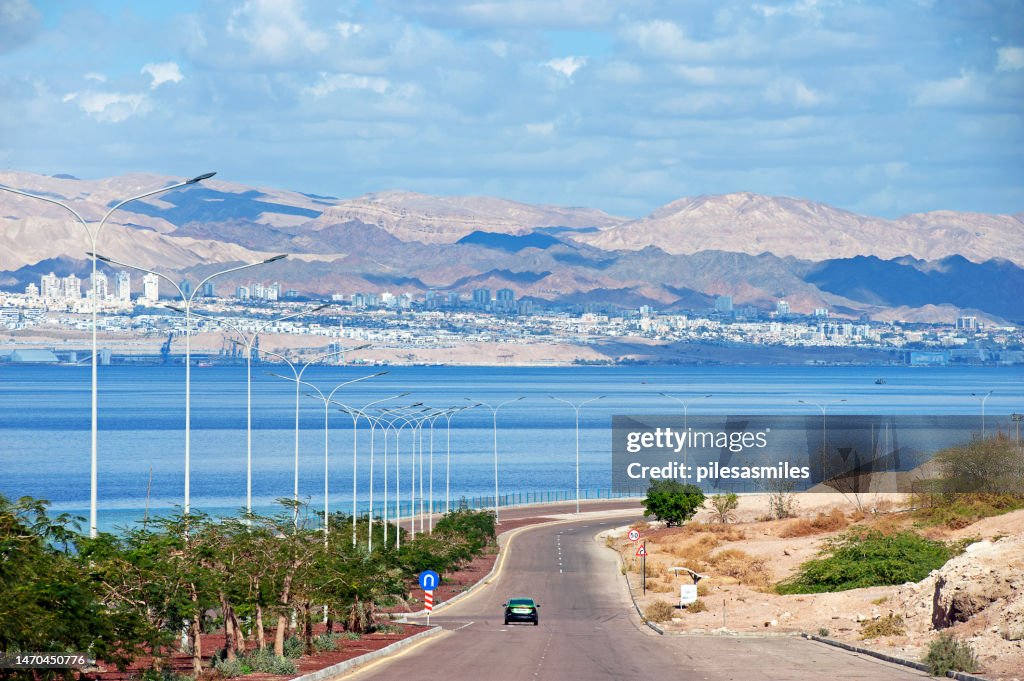 View over coastal road from Aqaba towards Israel and the city of Eilat, Aqaba, Jordan