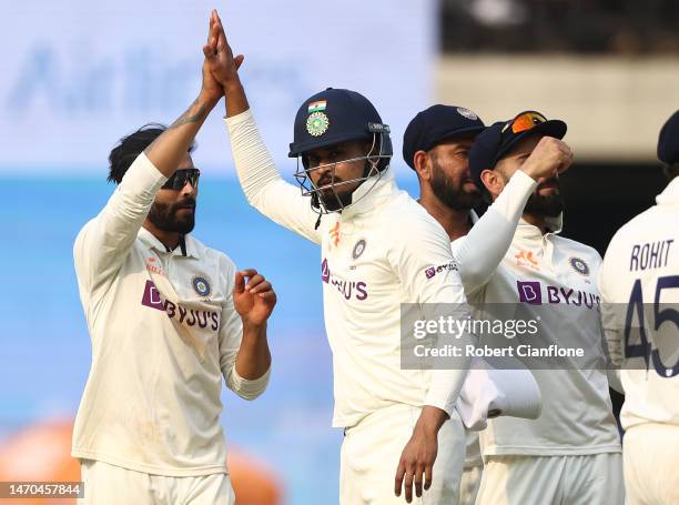 Ravindra Jadeja of India celebrates taking the wicket of Steve Smith of Australia during day one of the Third Test match in the series between India...