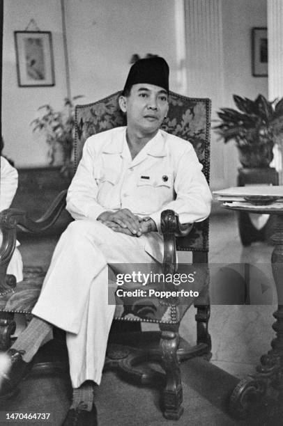 Indonesian statesman Sukarno , recently appointed President of Indonesia, attends a meeting following Indonesia's declaration of independence, at a...