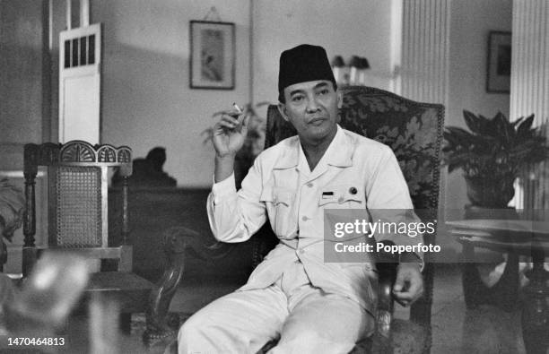 Indonesian statesman Sukarno , recently appointed President of Indonesia, attends a meeting following Indonesia's declaration of independence, at a...
