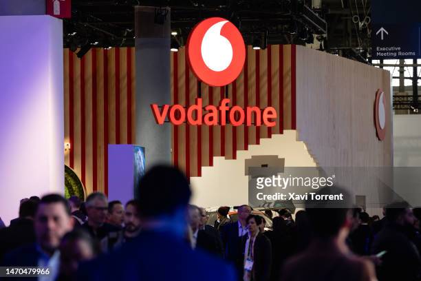 Logo sits illuminated at the Vodafone booth on day 2 of the GSMA Mobile World Congress at Fira Barcelona on February 28, 2023 in Barcelona, Spain.