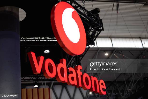 Logo sits illuminated at the Vodafone booth on day 2 of the GSMA Mobile World Congress at Fira Barcelona on February 28, 2023 in Barcelona, Spain.