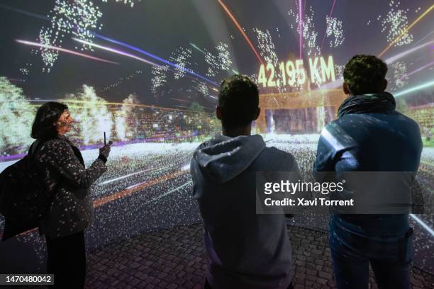 Visitors enjoy an immersive experience at the Orange booth on day 2 of the GSMA Mobile World Congress at Fira Barcelona on February 28, 2023 in...