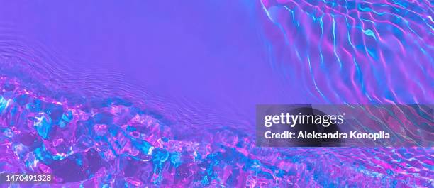 banner with ethereal bright holographic purple, pink, lilac transparent water surface texture with ripples, splashes, waves - acid trip stock pictures, royalty-free photos & images